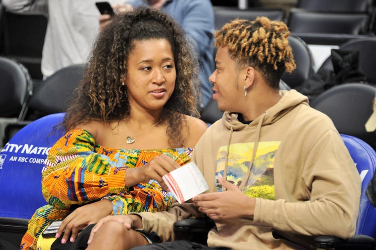 Naomi Osaka and YBN Cordae attend a basketball game between the Los Angeles Clippers and the Washing...