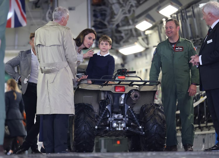Prince Louis of Wales sits inside a vehicle on a C17 plane with Catherine, Princess of Wales