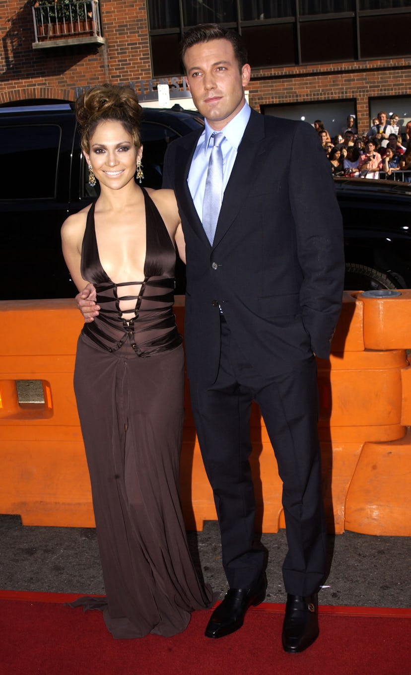 Jennifer Lopez wears a brown plunging cut-out dress with Ben Affleck.