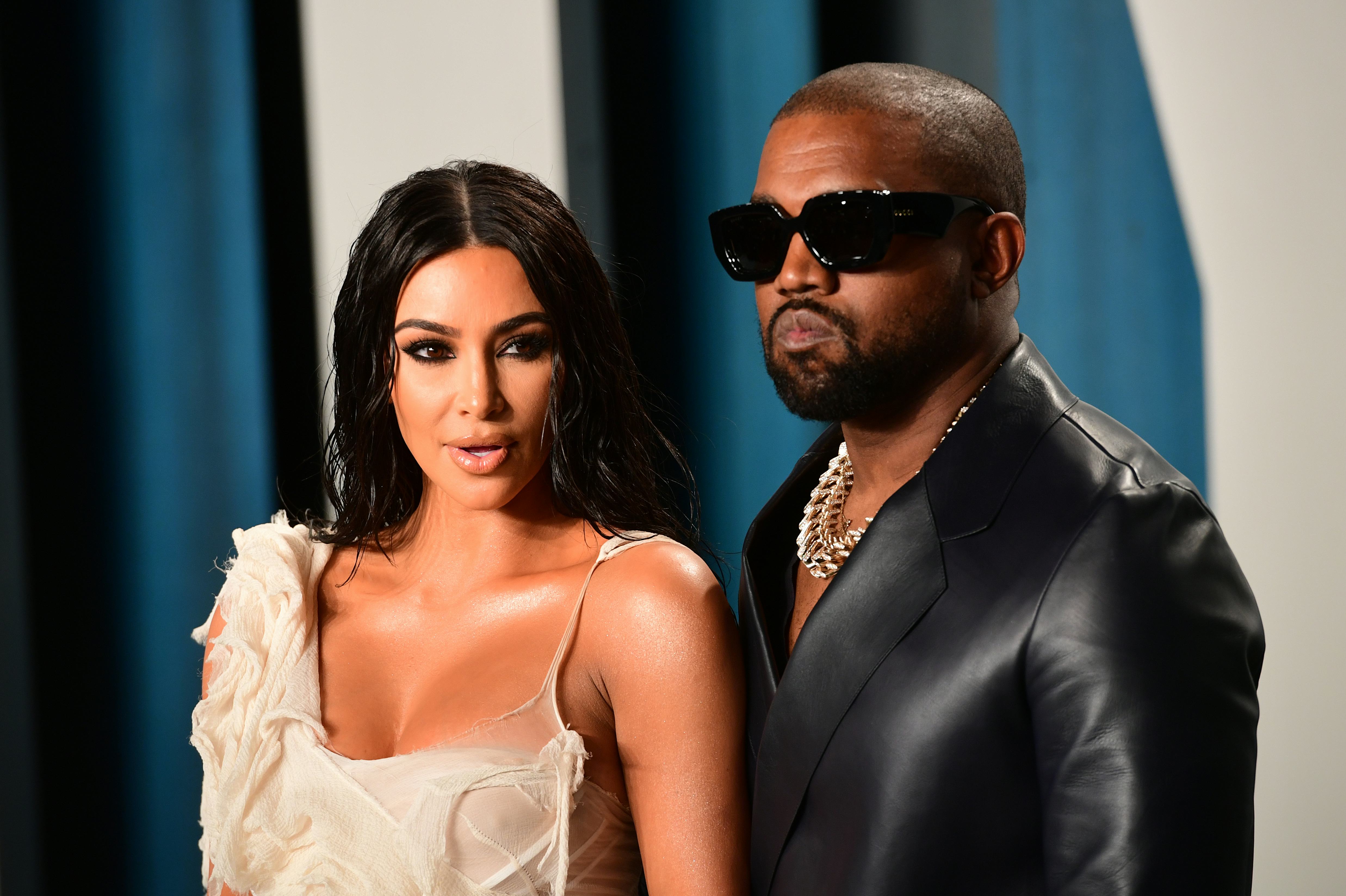 Kim Kardashian and Kanye West attending the Vanity Fair Oscar Party.