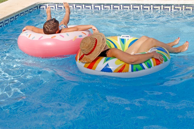 Mother and son relaxed on inflatable ring