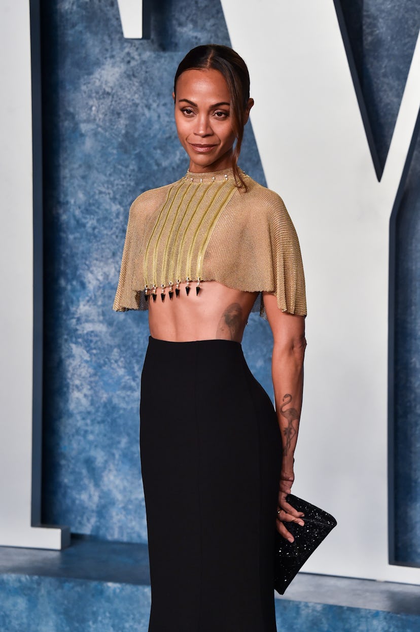 Zoe Saldana arrives at the 2023 Vanity Fair Oscar Party.
