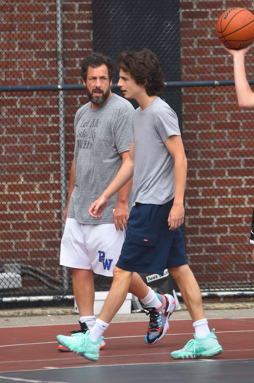 Timothee Chalamet and Adam Sandler are seen playing basketball in Soho on July 20, 2023 in New York ...