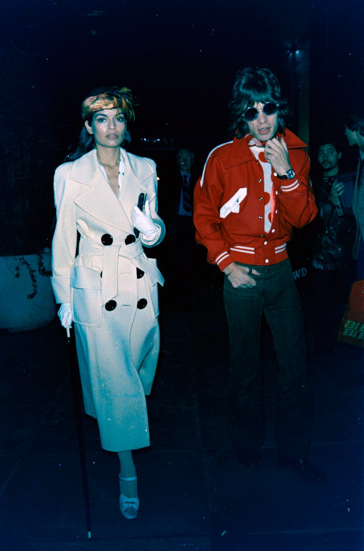 Bianca Jagger (L) and Mick Jagger attend a party celebrating Yves St. Laurent at '21' in New York Ci...