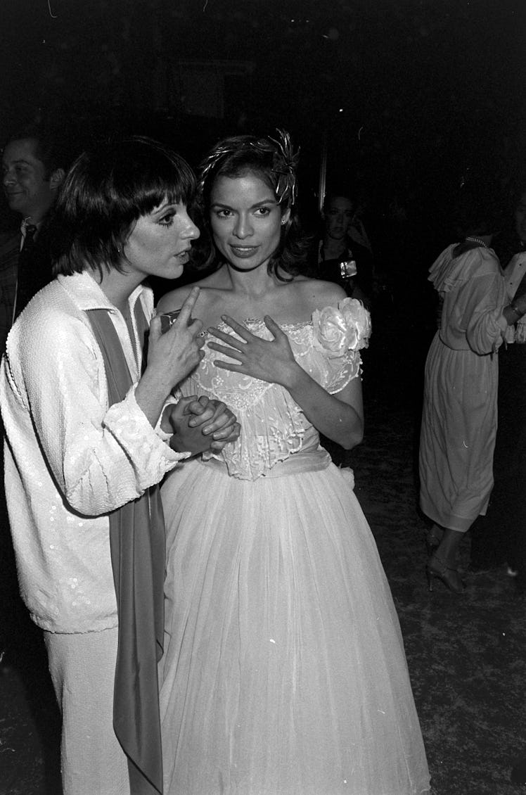 Liza Minnelli (L) and Bianca Jagger (C) attend a party at Studio 54 in New York City on December 12,...