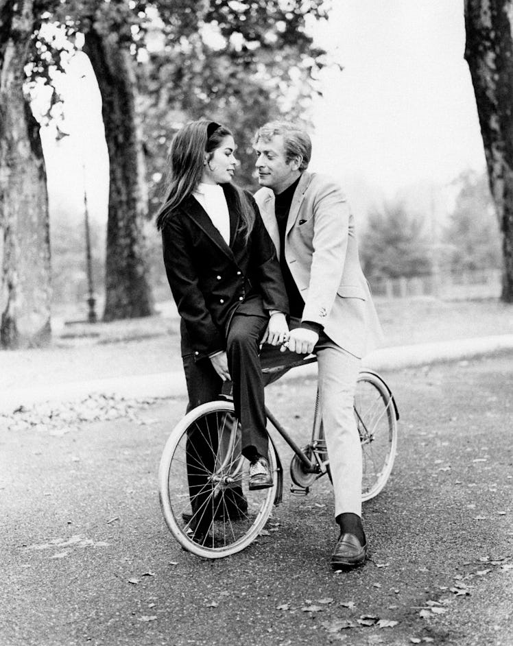 British actor Michael Caine during a bike ride in a park with the Nicaraguan model Bianca Pérez-Mora...