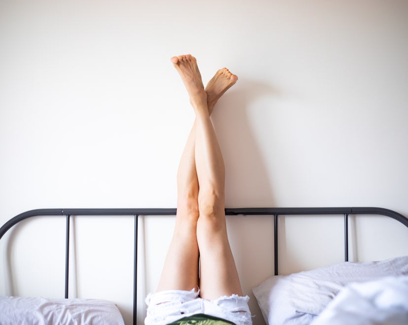 Tips for what to do after sex to conceive include laying like this woman, with her legs straight up ...