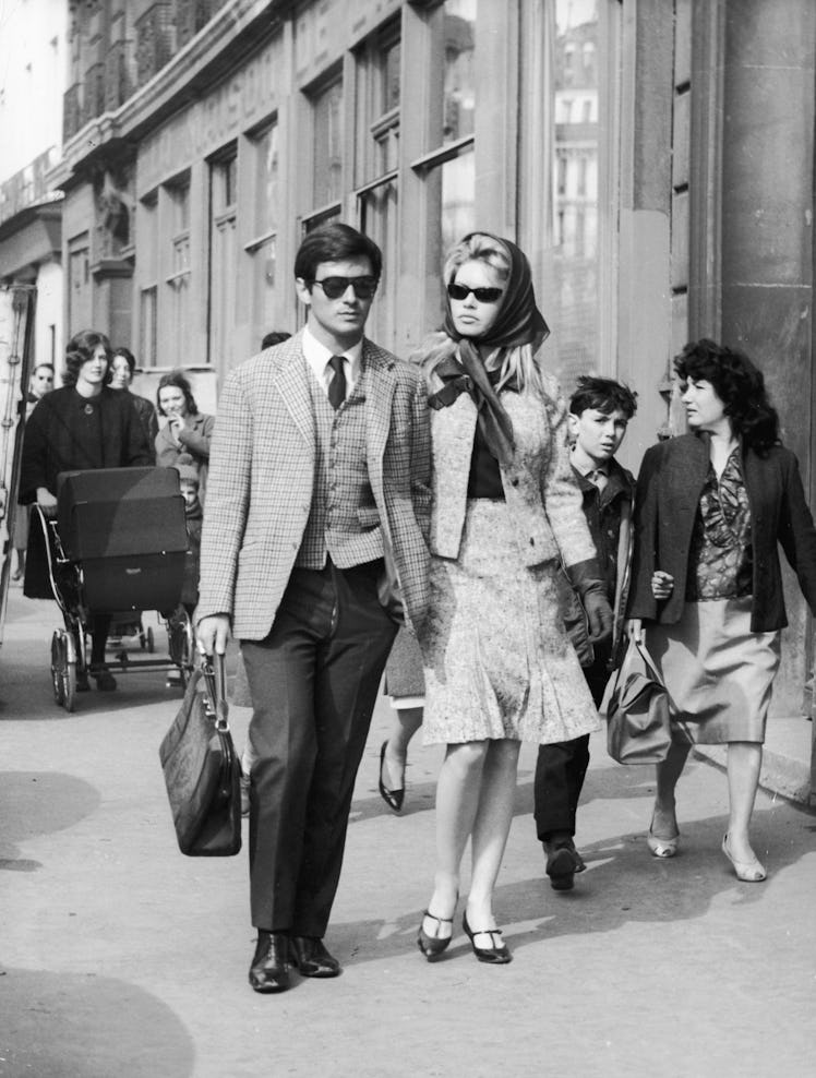 French actors Sami Frey and Brigitte Bardot are followed by fans 