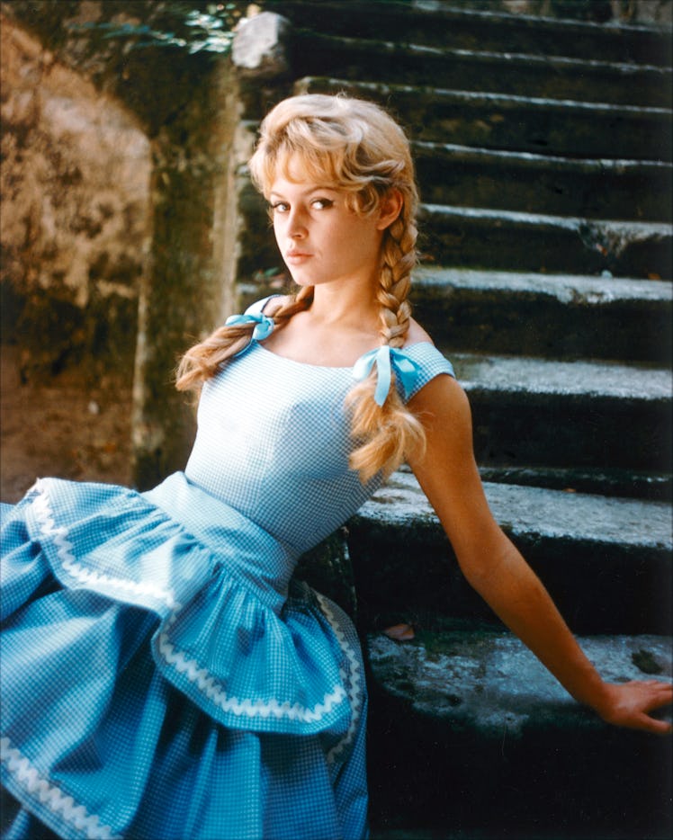 Brigitte Bardot, French actress, model and singer, wearing a blue gingham dress 