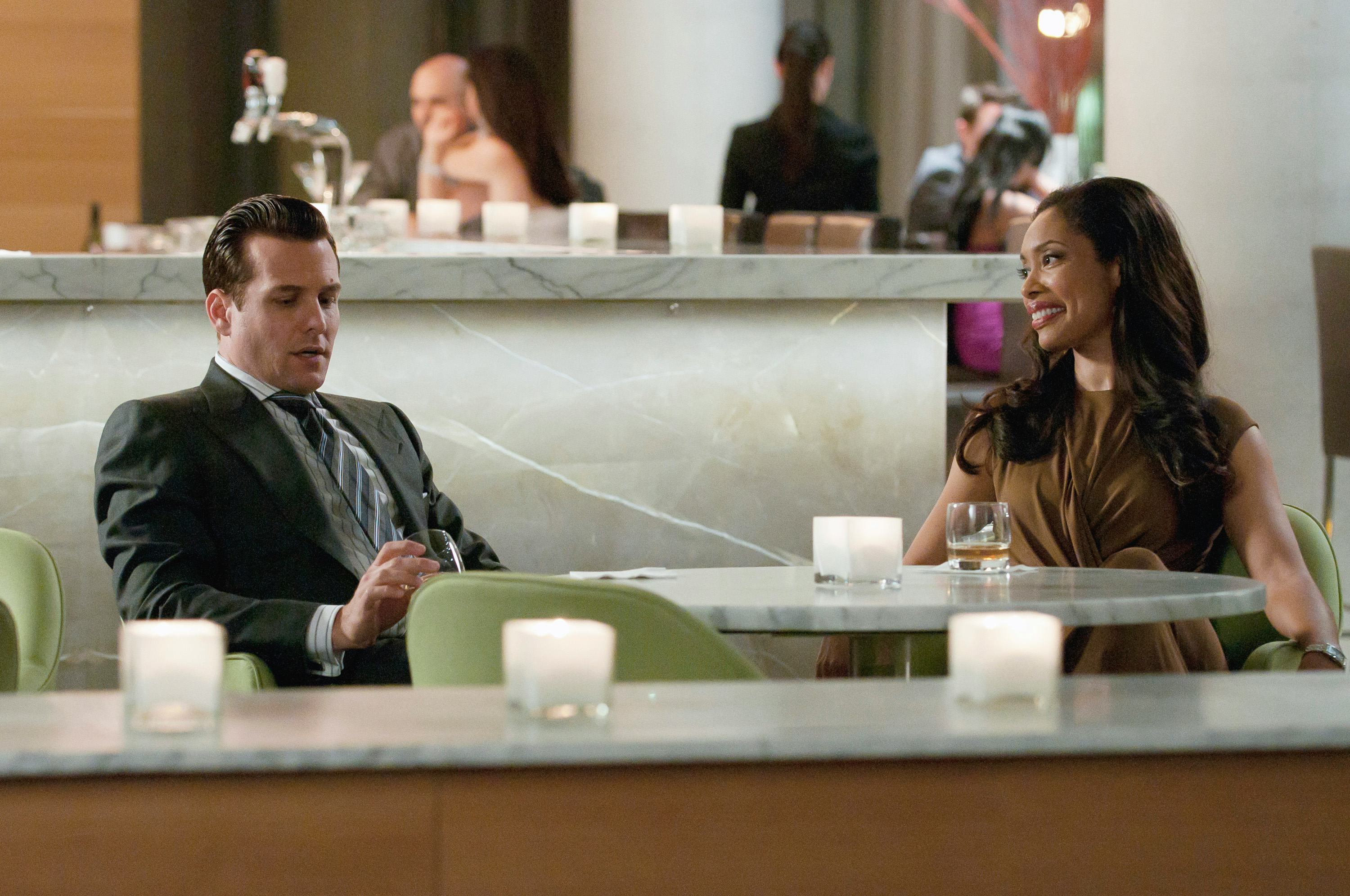 SUITS &ndash; &ldquo;Dirty Little Secrets&rdquo; Episode 104 &ndash; Pictured: (l-r) Gabriel Macht as Harvey Specter, Gina&hellip;