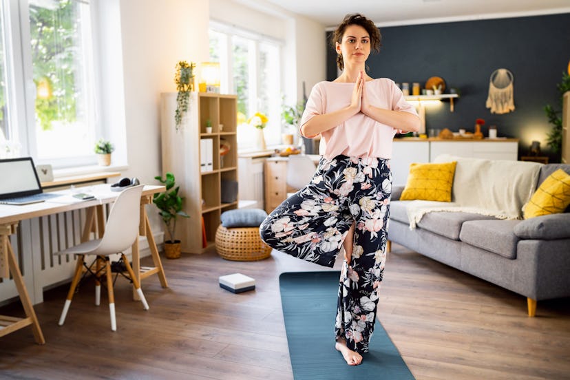 Tree pose is a grounding yoga pose that’s good for the root chakra.