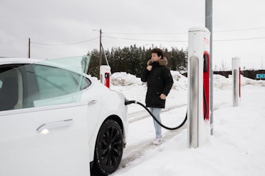 Tesla owner Philip Benassi is seen at a charging station in Jessheim, southeast Norway on January 17...