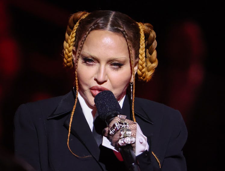 Madonna speaks on stage at the 65th Grammy Awards.