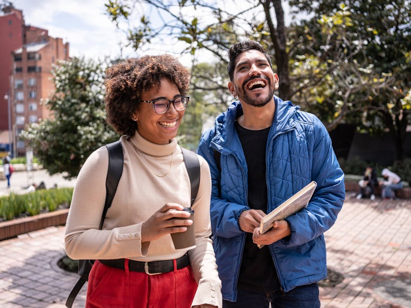 Young university students walking and talk outdoors
