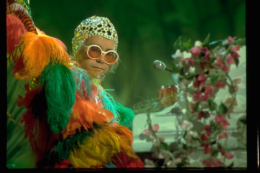English pop/rock musician Elton John performing his song 'Crocodile Rock' on the set of The Muppet S...
