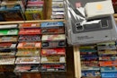 This photo taken on August 12, 2017 shows game cartridges alongside a Nintendo Super Famicom, a clas...