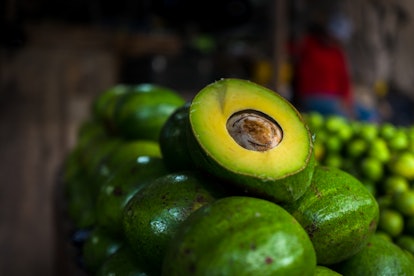 BARRANQUILLA, COLOMBIA - NOVEMBER 12: Fresh and ripe avocados are seen arranged on the market stand ...