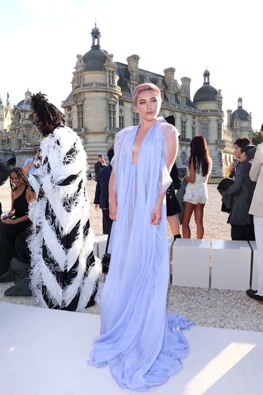 Florence Pugh wears a sheer lilac gown and exposed her undies to attend the Valentino Haute Couture ...