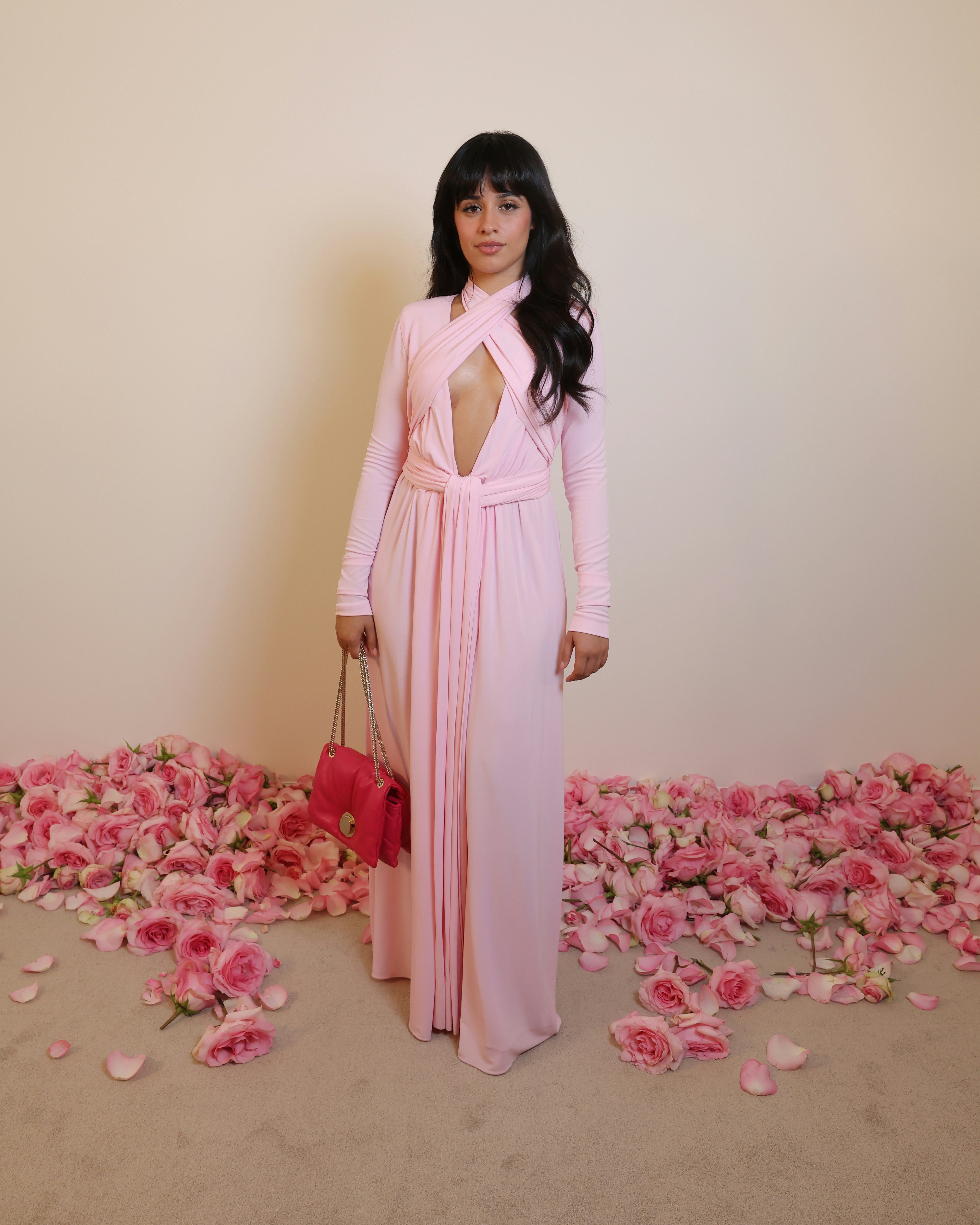 Camila Cabello wears a baby pink jersey dress with a plunging neck and criss-cross halter detail to &hellip;