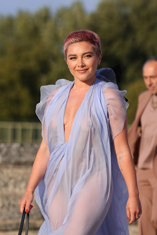 Florence Pugh wears a sheer lilac gown and exposed her undies to attend the Valentino Haute Couture ...