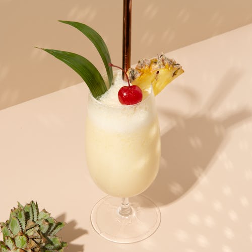 Pina Colada with pineapple and cherry on top