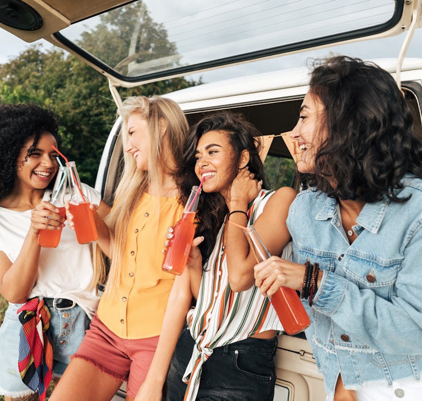 a group of young women enjoy bottles of soda together as they discuss how the august 2023 super stur...