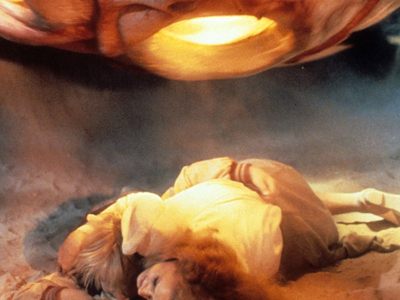 Karen Black ducks in a scene from the film 'Invaders From Mars', 1986. (Photo by Cannon/Getty Images...