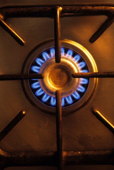 A birds-eye-view photo of a lit gas stove burner