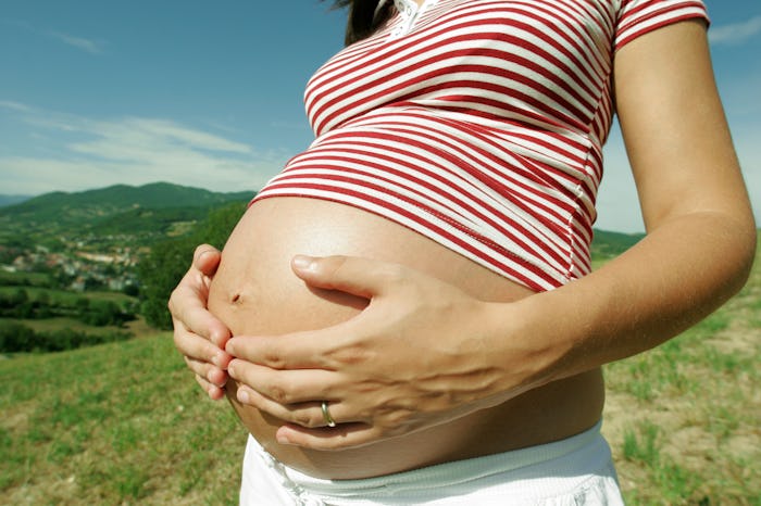 pregnant woman in the summer in article about pregnancy safe bug sprays