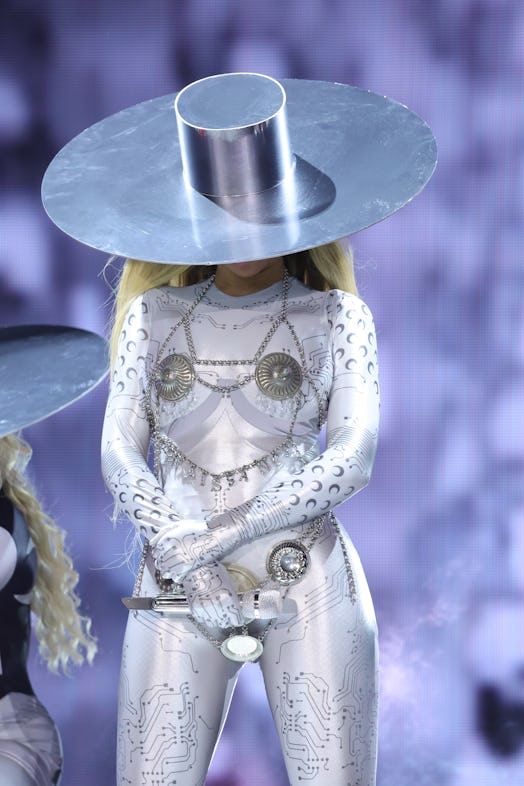 Beyoncé wears an all-silver outfit with a nipple cover bodychain during the Chicago leg of her Renai…