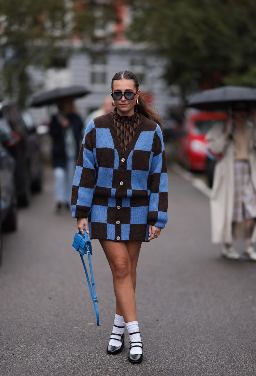 COPENHAGEN, DENMARK - AUGUST 09: Lina Uhrig seen wearing Corlin Eyewear black sunglasses with blue t...