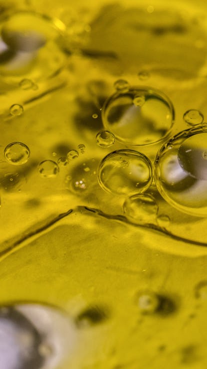 Drops of water form abstract bubbles in olive oil. Photographer: Angel Garcia/Bloomberg.