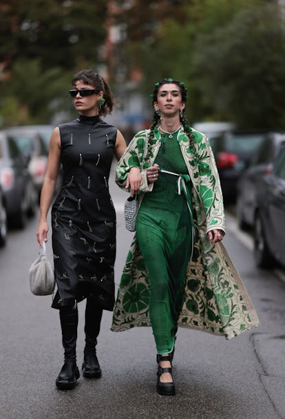 COPENHAGEN, DENMARK - AUGUST 09: Lea Naumann (L) seen wearing Prada black sunglasses, green flower r...