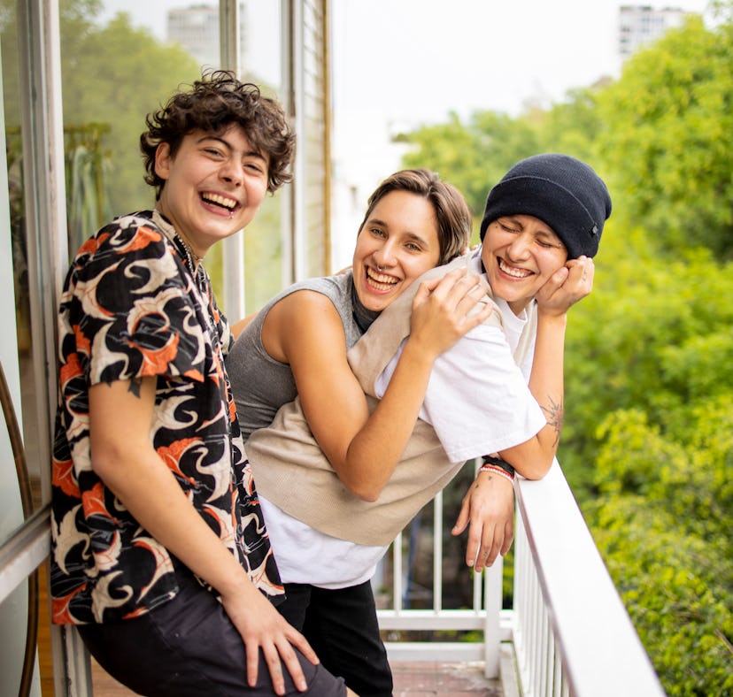 three young friends smile for a group photo as they consider how the august 2023 super blue moon wil...