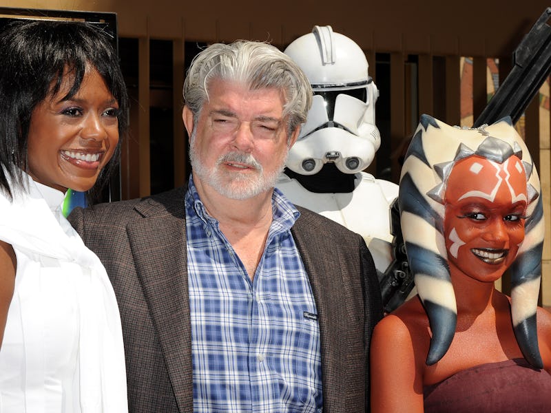 Director/producer George Lucas (C), his guest Mellody Hobson (L) and the character Ahsoka Tano (R) p...