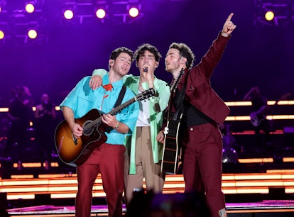 NEW YORK, NEW YORK - AUGUST 12: (L-R) Nick Jonas, Joe Jonas, an Kevin Jonas perform onstage during J...