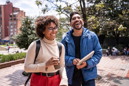 Young university students walking and talk outdoors