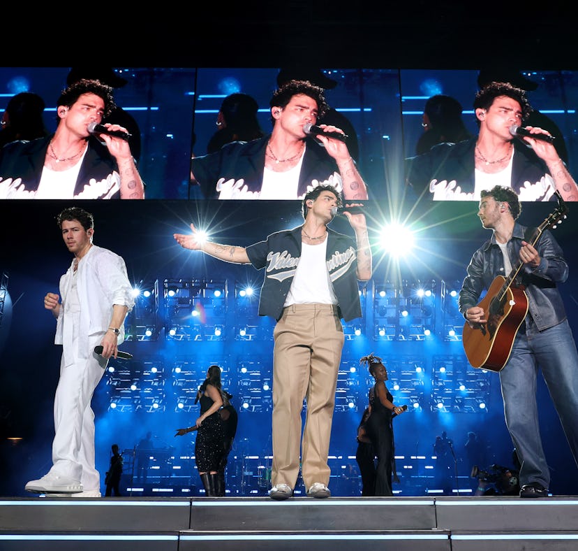 NEW YORK, NEW YORK - AUGUST 12: (L-R) Nick Jonas, Joe Jonas, and Kevin Jonas perform onstage during ...