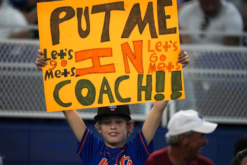 MIAMI, FL - JULY 31: A New York Mets fan holds up a sign during the game against the Miami Marlins a...