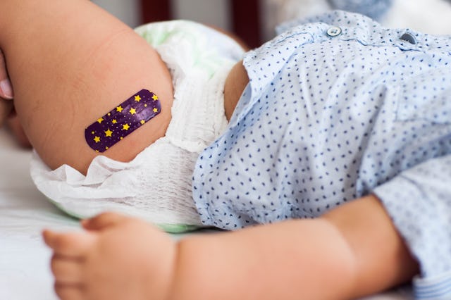 a baby with a bandaid, perhaps after getting a dose of Nirsevimab, a new RSV prevention tool.