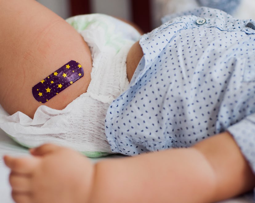a baby with a bandaid, perhaps after getting a dose of Nirsevimab, a new RSV prevention tool.
