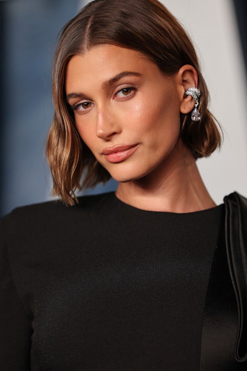 Hailey Bieber debuted a new "cinnamon cookie butter" hair color for fall 2023 on Instagram. Here, Bi...