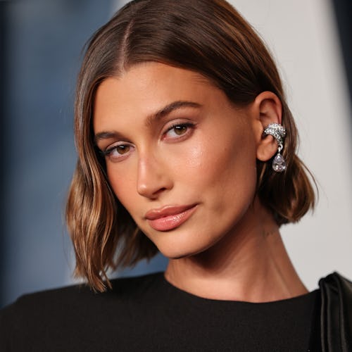Hailey Bieber debuted a new "cinnamon cookie butter" hair color for fall 2023 on Instagram. Here, Bi...