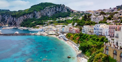 Beautiful coastline of Capri along the port area. Aerial view from drone