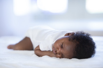 Baby sleeps with butt in air on belly in a story answering the question, why do babies sleep with th...