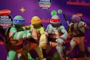 MEXICO CITY, MEXICO - AUGUST 27: Teenage Mutant Ninja Turtles pose during the orange carpet of the N...