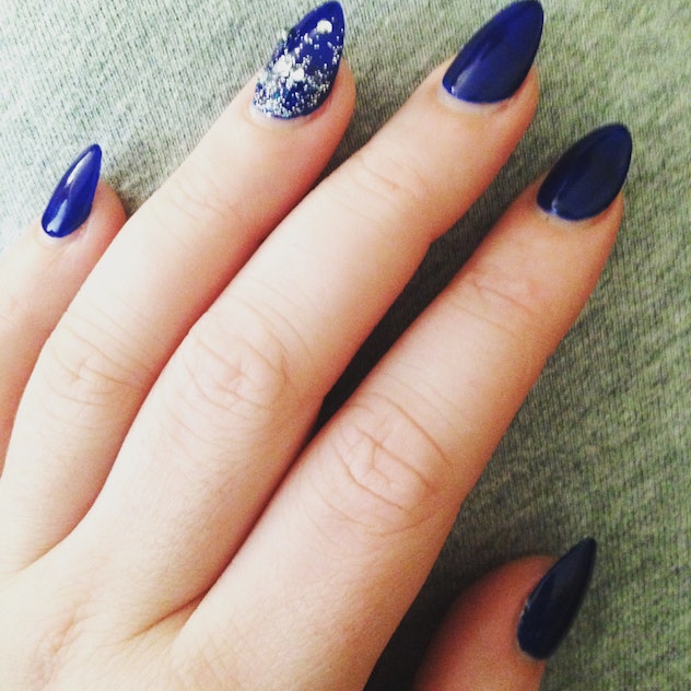 A nice dark blue with an accent nail of sparkles and gems.