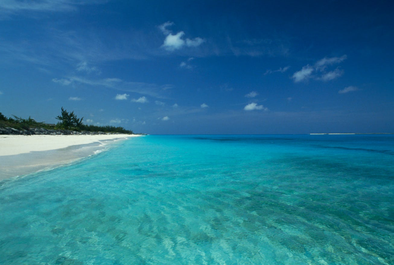 BAHAMAS - APRIL 23: Crystal clear sea and the beach along the coast north of George Town, Great Exum...