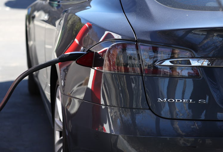 SAN RAFAEL, CALIFORNIA - FEBRUARY 15: A Tesla car is seen plugged into a Tesla Supercharger on Febru...