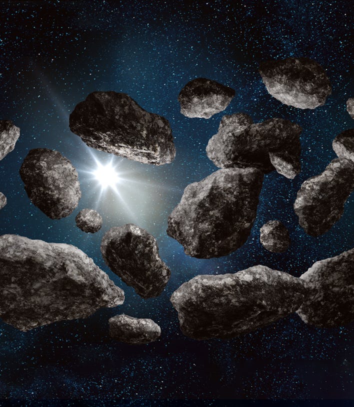 Inside asteroid belt in deep space on starfield background